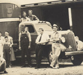group in front of truck and train car 1937